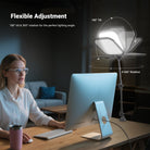 A woman works at a home office desk with an all-in-one computer, illuminated by the NEEWER L220 Bi Color Panel Light with Desk Stand.